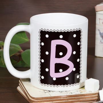 Pöttyös monogramos fekete bögre